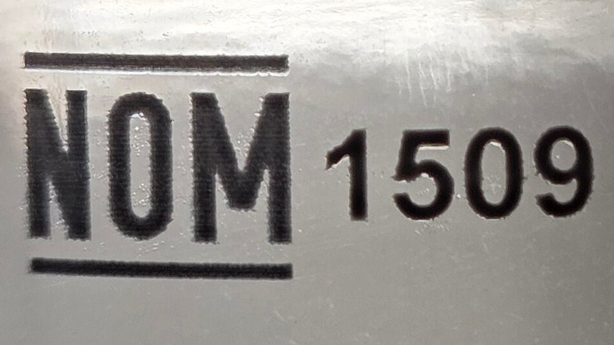 Close-up of a NOM 1509 distillery number printed on a tequila label.