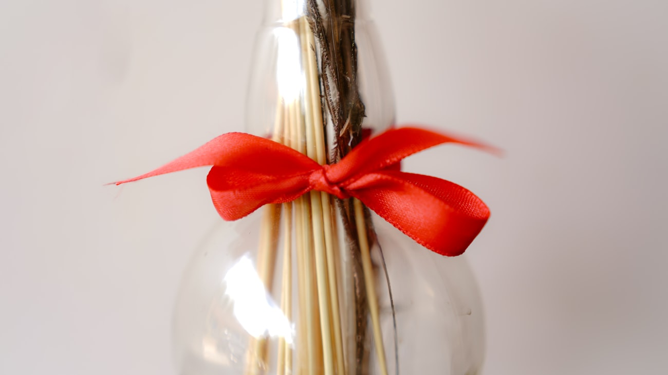 Bottle finished with a ribbon bow as a housewarming thank-you gift