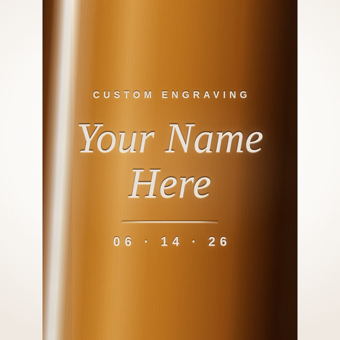 Custom engraving on a whiskey bottle, etched with Your Name Here and a date
